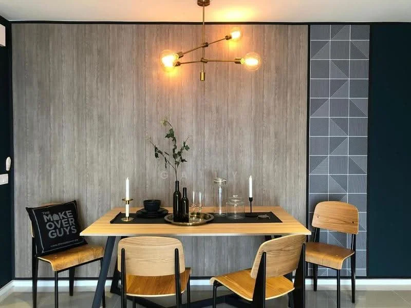 Dining features: wood dining table, 4 wooden dining chairs, pendant light fixture with multiple bulbs, decorative wall with wood paneling, geometric patterned wall, black table runner, candles on the table, glass vase with greenery, black decorative cushion with text; style: modern.