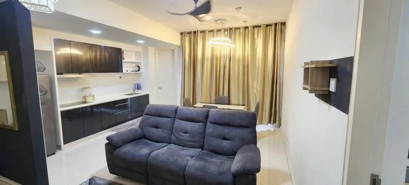 Living features: 3-seater fabric sofa in grey, coffee table, wall-mounted TV, recessed LED downlights, chandelier, cream painted walls, floor-to-ceiling curtains in gold, kitchenette with black cabinetry, white countertop, stainless-steel fridge, dining table for 4, tile flooring; style: modern.
