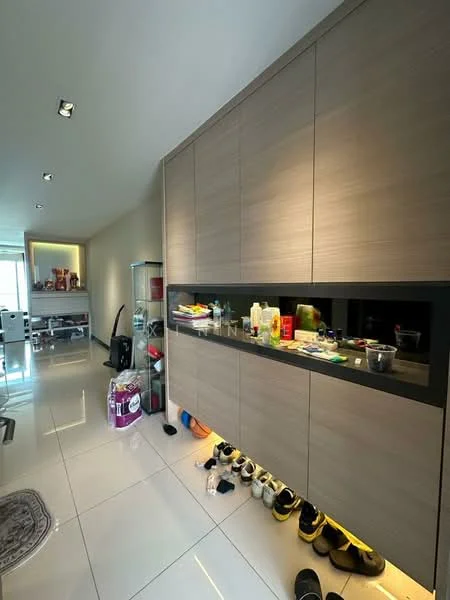 Room features: light grey wood cabinetry, black countertop, white glossy tile flooring, recessed downlights, decorative wall mirror, various cleaning supplies on countertop, plastic storage containers, shoes lined up on the floor, area rug with circular pattern; style: modern.