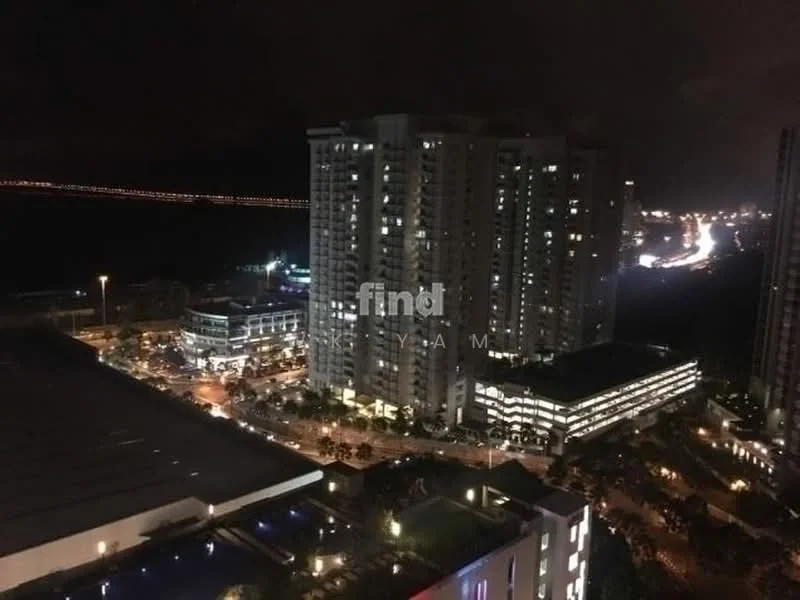 Exterior type: high-rise condominium; features: city skyline view, night lighting, surrounding urban landscape, nearby road with traffic, commercial buildings visible, manicured landscaping at base; style: modern.