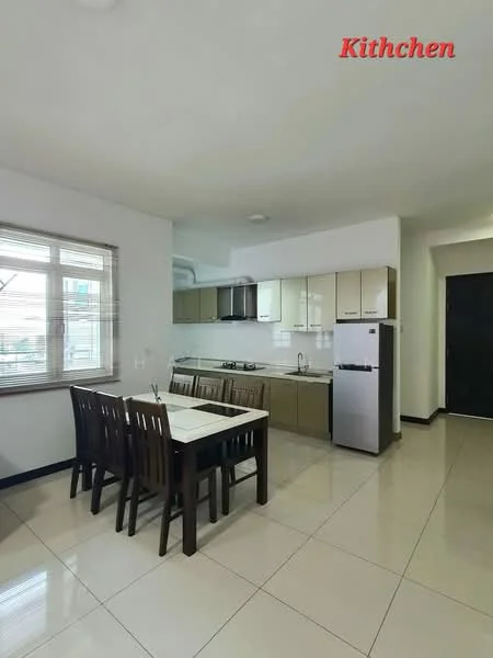 Kitchen features: white painted walls, cream cabinetry, black countertop, stainless-steel fridge, built-in gas stove, oven, double-bowl stainless-steel sink, chrome pull-down faucet, dining table with 6 wooden chairs, tile flooring, window with blinds, recessed lighting; style: modern.