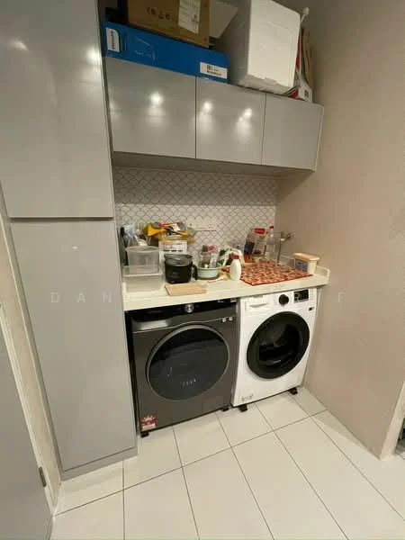 Laundry features: grey cabinetry, white countertop, black front-load washing machine, white front-load washing machine, hexagonal tile backsplash, white tiled flooring, various storage containers, kitchen utensils, stacked appliances; style: modern.
