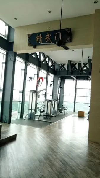 Room features: large windows with city view, wooden flooring, high ceiling, ceiling fan, exercise equipment, open space layout, decorative wall sign, natural light from windows; style: modern; view: city.