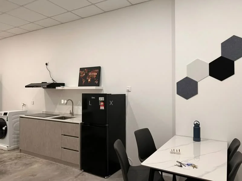 Kitchen features: single-bowl stainless-steel sink, chrome pull-down faucet, black refrigerator, built-in kitchen cabinetry in light wood, marble countertop, washing machine, wall-mounted range hood, hexagonal wall decor, dining table with black chairs, water bottle on table; style: modern.