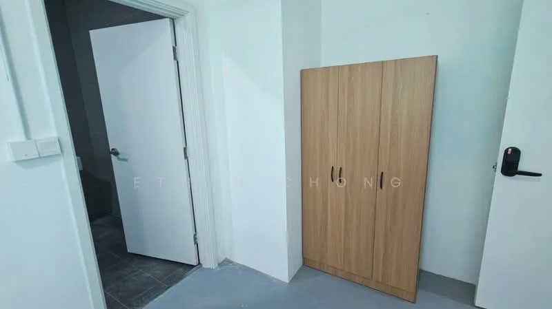 Room features: light grey walls, grey tiled flooring, wooden cabinet with two doors, white door, door handle, corner space, minimalist design; style: modern.