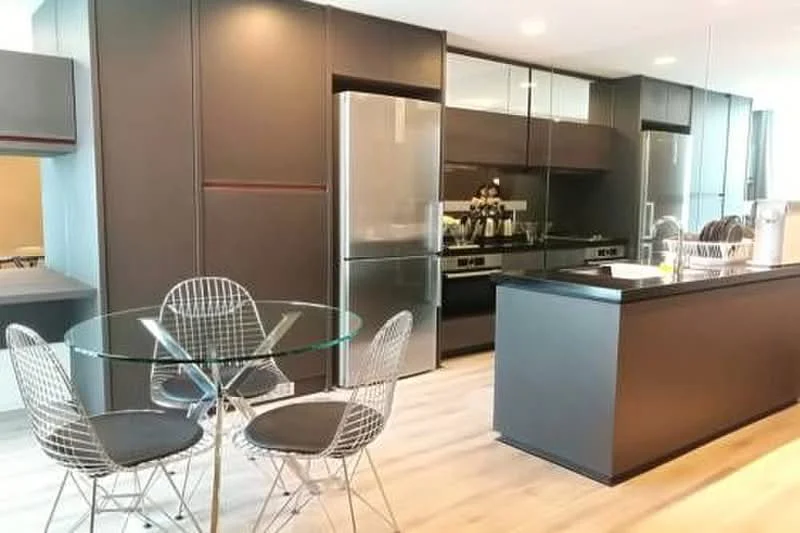 Kitchen features: stainless-steel fridge, built-in oven, freestanding range oven, black cabinetry, glass countertop, kitchen island, modern dining table, wireframe dining chairs, recessed downlights, wooden flooring, open layout; style: modern.