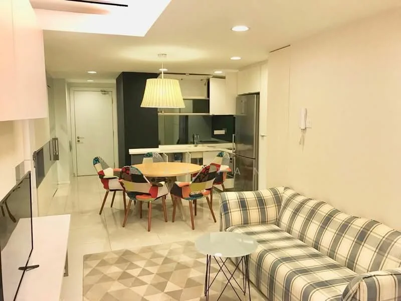 Living features: plaid fabric sofa, coffee table, area rug with geometric pattern, wall-mounted TV, dining table with 6 colorful chairs, pendant light fixture, white cabinetry, stainless-steel refrigerator, built-in oven, kitchen island, open-plan layout, neutral painted walls, tile flooring; style: modern.