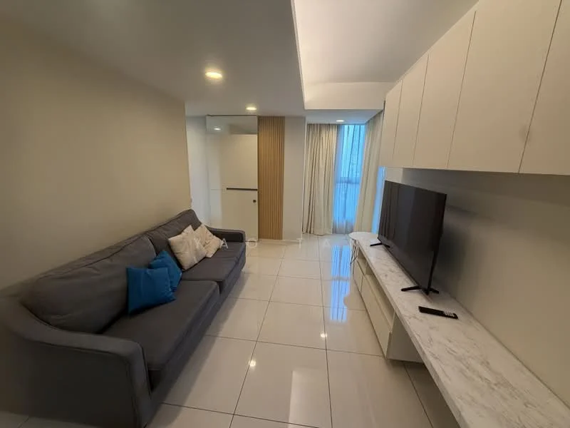 Living features: grey fabric sofa, white marble TV console, wall-mounted TV, white cabinetry, white tiled flooring, recessed downlights, floor-to-ceiling windows with sheer curtains, decorative cushions in blue and white; style: modern.