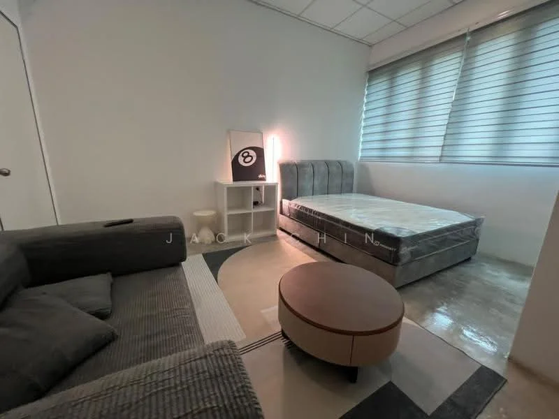 Bedroom features: queen-size bed, upholstered headboard, bedside lamp, sofa in grey fabric, round coffee table, floor-to-ceiling windows, roller blinds, polished concrete flooring, white painted walls, ceiling lights; style: modern.