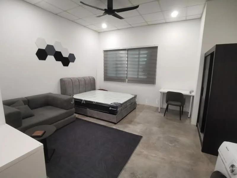 Bedroom features: grey upholstered bed frame, queen-size bed, grey fabric sofa, white desk, grey chair, concrete flooring, ceiling fan, roller blinds on windows, hexagonal wall decor, wall-mounted air conditioning unit; style: modern.
