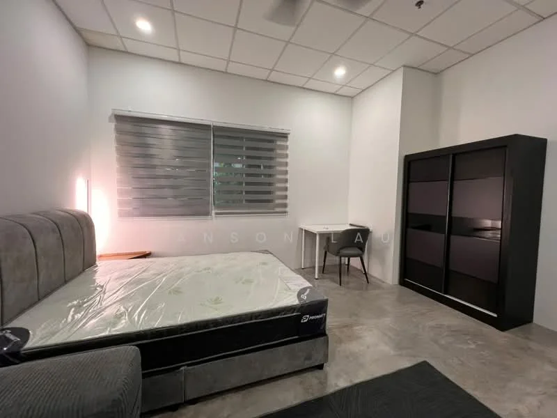 Bedroom features: queen-size bed with mattress, grey upholstered headboard, grey fabric bed frame, black wardrobe with sliding doors, white desk, black chair, concrete flooring, roller blinds on windows, ceiling fan, wall-mounted light fixture; style: modern.