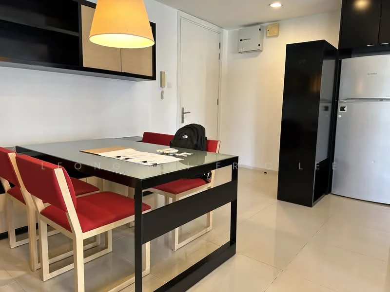 Dining features: black dining table, 4 wooden dining chairs with red upholstery, white painted walls, tile flooring, recessed downlights, wall-mounted air conditioning unit, black cabinetry, stainless-steel fridge, open shelving above the table; style: modern.