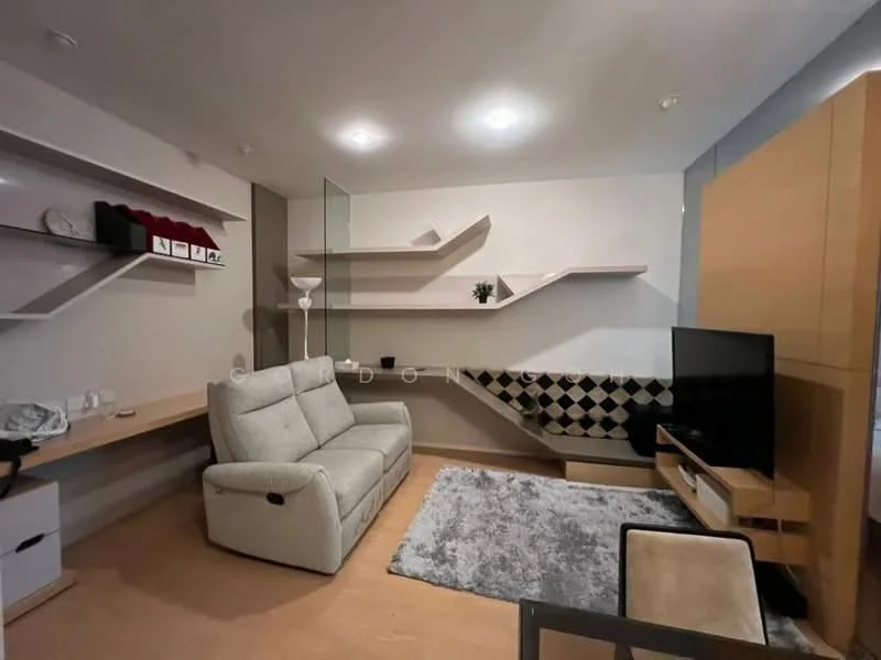Living features: light grey fabric sofa, wooden coffee table, wall-mounted TV, floating shelves, decorative plant, black and white patterned wall feature, light wood cabinetry, area rug with geometric pattern, laminate flooring, recessed lighting; style: modern.