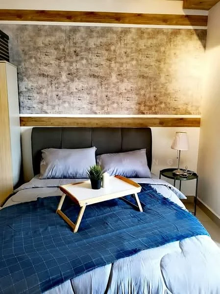 Bedroom features: king-size bed, upholstered headboard in grey, grey bedding, blue throw blanket, decorative plant on bedside table, black round bedside table, table lamp with white shade, textured accent wall with grey and brown tones, wooden ceiling beams, light-colored flooring; style: modern.