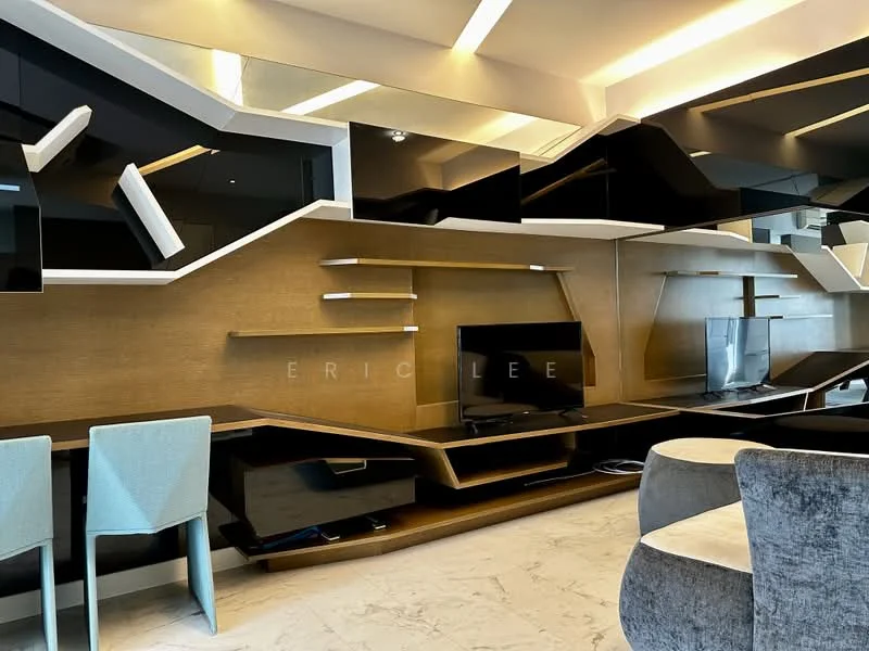 Living features: black and gold accent wall, built-in TV console, wall-mounted TV, floating shelves, modern coffee table, upholstered armchair, marble flooring, recessed lighting, mirrored wall accents, open layout, decorative wall panels; style: modern.