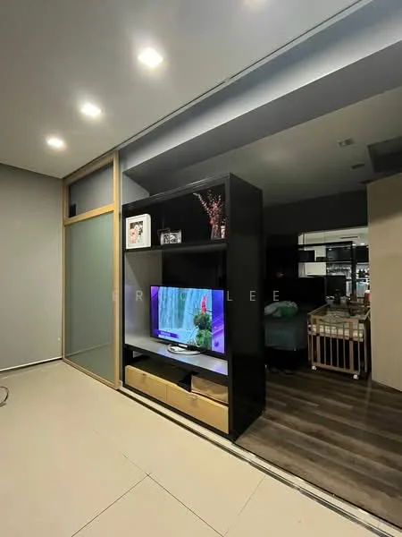 Living features: grey painted walls, recessed downlights, built-in shelving unit, television on stand, wooden flooring, glass partition, decorative plant, storage drawer under shelving; style: modern.
