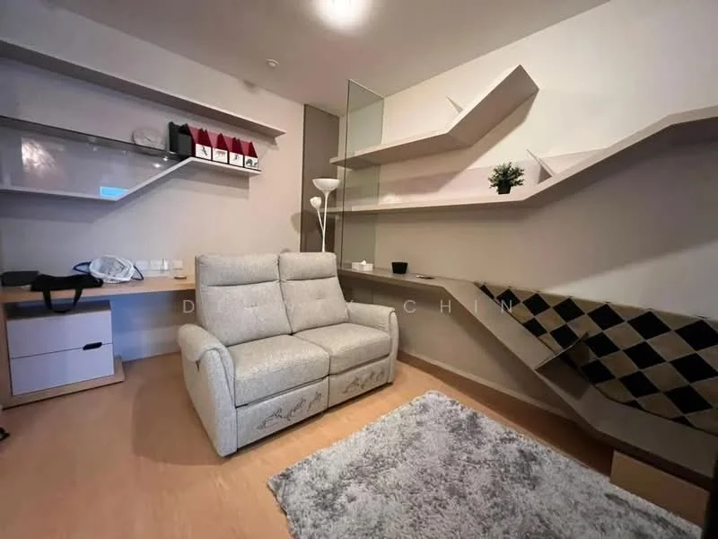 Living features: reclining fabric sofa in light grey, wooden coffee table, floating shelves, decorative plant on shelf, wall-mounted lamp, area rug with geometric pattern, light wood flooring, built-in desk with storage drawers; style: modern.
