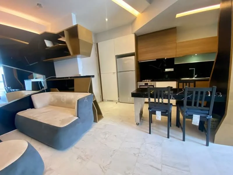 Living features: grey fabric sofa, cream upholstered seating area, black dining table, 4 black dining chairs, white marble flooring, black cabinetry, wooden cabinetry, built-in refrigerator, black countertop, recessed lighting, open layout, mirrored wall, kitchen area with appliances; style: modern.
