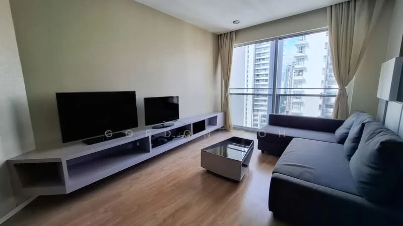 Living features: grey fabric L-shape sectional sofa, glass coffee table, 2 wall-mounted flat-screen TVs, light wood flooring, floor-to-ceiling windows, sheer curtains, light beige painted walls, built-in TV console with storage; style: modern; view: city.