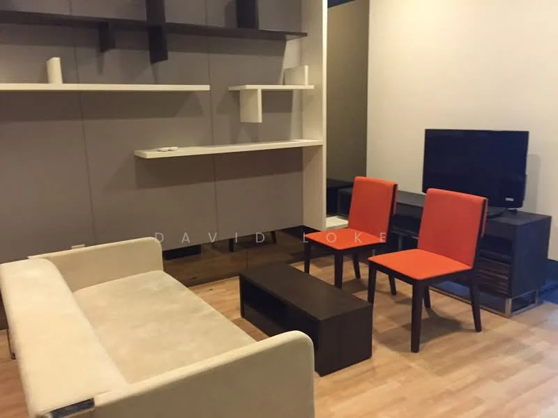 Living features: light wood flooring, cream fabric sofa, 2 orange dining chairs, dark wood coffee table, wall-mounted TV, dark wood TV console, floating shelves, neutral painted walls; style: modern.