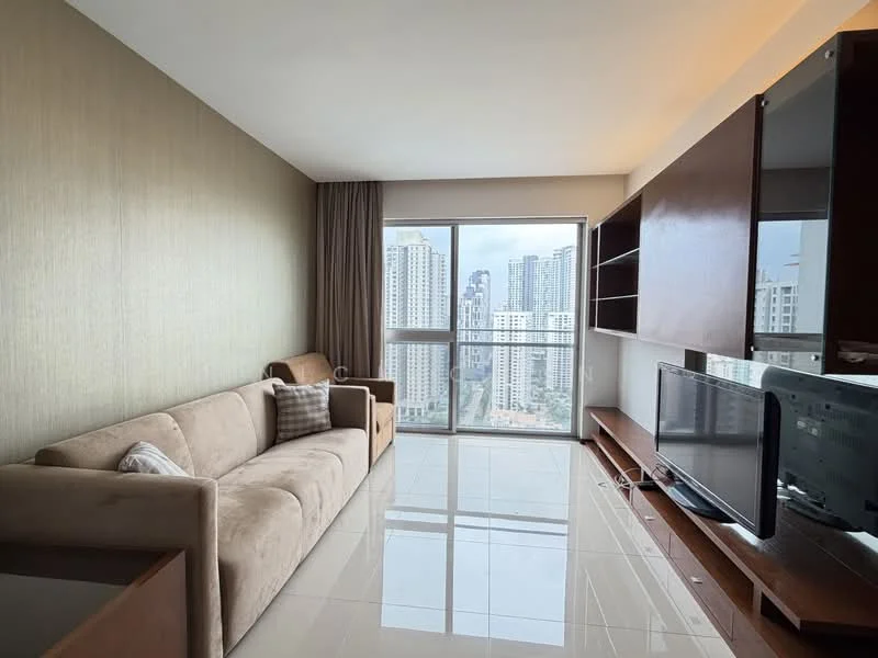 Living features: beige fabric sofa, coffee table, TV console, wall-mounted TV, floor-to-ceiling windows, city skyline view, light-colored tiled flooring, textured accent wall in light brown, curtains, built-in shelving unit; style: modern; view: city.
