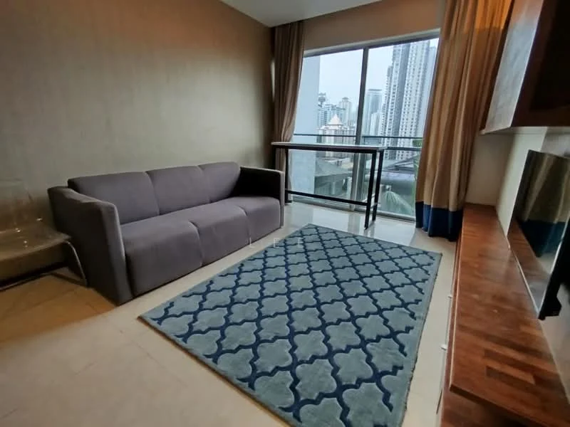 Living features: grey fabric sofa, area rug with geometric pattern in blue, floor-to-ceiling windows, curtains in beige, wooden console, light-colored walls, tile flooring, city skyline view; style: modern; view: city.
