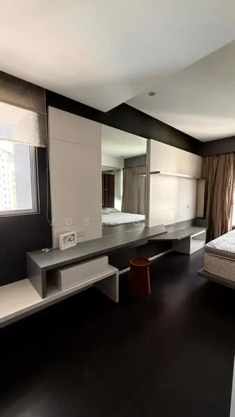 Bedroom features: dark wood flooring, large mirror on wall, built-in cabinetry, window with sheer curtains, queen-size bed, decorative stool, wall-mounted lighting, neutral wall color; style: modern; view: city.