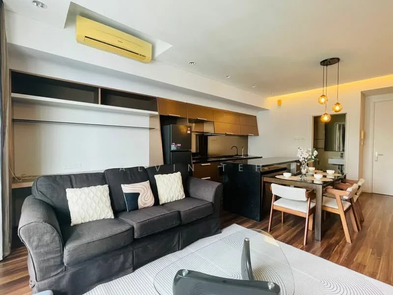 Living features: 3-seater fabric sofa in dark grey, coffee table with glass top, wooden dining table for 4, 4 upholstered dining chairs, black kitchen cabinetry, stainless-steel fridge, built-in oven, induction cooktop, recessed downlights, pendant lighting above dining table, wall-mounted split AC, wooden flooring, white walls, open shelving; style: modern.