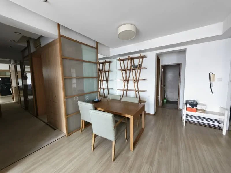 Room features: light wood flooring, white painted walls, ceiling light fixture, wooden dining table, two upholstered dining chairs in light grey, open shelving unit, glass partition, doorway leading to another room, wall-mounted phone, baseboard heating unit; style: modern.