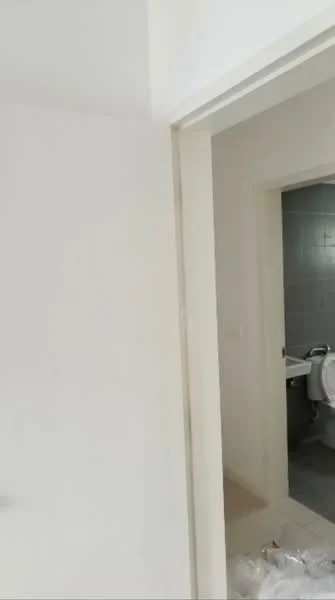 Room features: white painted walls, light-colored flooring, doorway leading to bathroom, neutral color scheme.