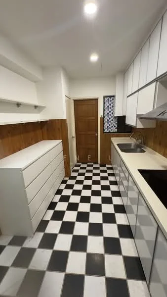 Kitchen features: black and white checkered tile flooring, white cabinetry with flat-panel doors, wood paneling on lower walls, single-bowl stainless-steel sink, chrome pull-down faucet, built-in stove, wall-mounted range hood, drawer storage, door leading to hallway, window with patterned curtain; style: modern.