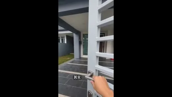 Exterior type: detached bungalow; features: grey painted facade, sliding glass door, stone-paved walkway, manicured lawn, covered porch, modern architectural design, single-storey, landscaped garden; style: modern.