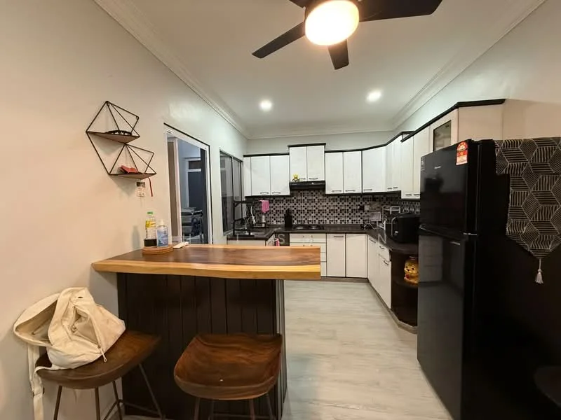 Kitchen features: white shaker cabinets, black countertop, black refrigerator, stainless-steel sink, chrome pull-down faucet, black and white mosaic tile backsplash, wooden bar counter, 2 wooden bar stools, recessed downlights, ceiling fan, grey laminate flooring; style: modern.