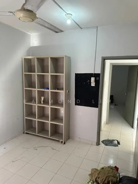 Room features: white painted walls, tile flooring, ceiling fan, built-in shelving unit with cubbies, doorway leading to another room, visible clutter on the floor.
