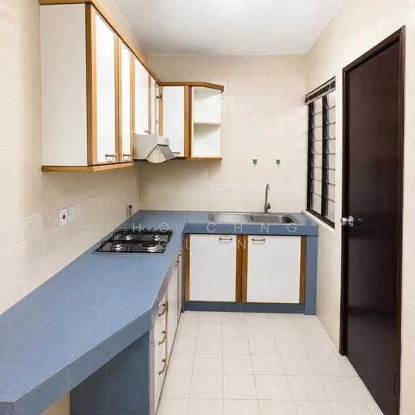 Kitchen features: blue laminate countertop, white cabinets with wooden accents, built-in gas stove, single-bowl stainless-steel sink, wall-mounted range hood, tile backsplash, cream tiled walls, light-colored floor tiles, window with metal grilles, door with wooden frame; style: modern.
