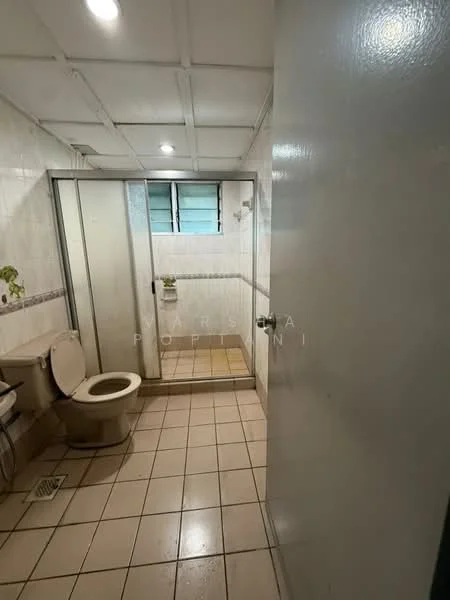 Bathroom features: white tiled walls, cream tiled flooring, glass shower enclosure, toilet, sink, mirror, window, shower head.