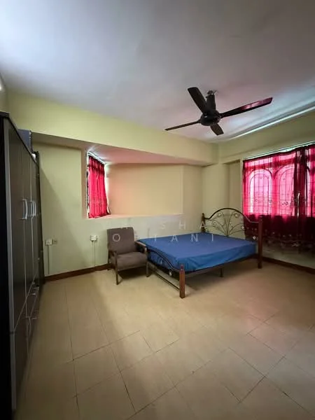 Bedroom features: single bed frame, blue mattress, wooden wardrobe with sliding doors, ceiling fan, red curtains, tile flooring, corner chair, window with decorative grille.