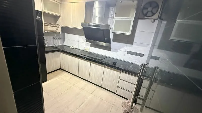 Kitchen features: black granite countertop, light wood cabinetry, stainless-steel range hood, built-in oven, 4-burner gas hob, double-bowl stainless-steel sink, wall-mounted fan, tile backsplash, ceramic tile flooring, open shelving, under-cabinet lighting; style: modern.