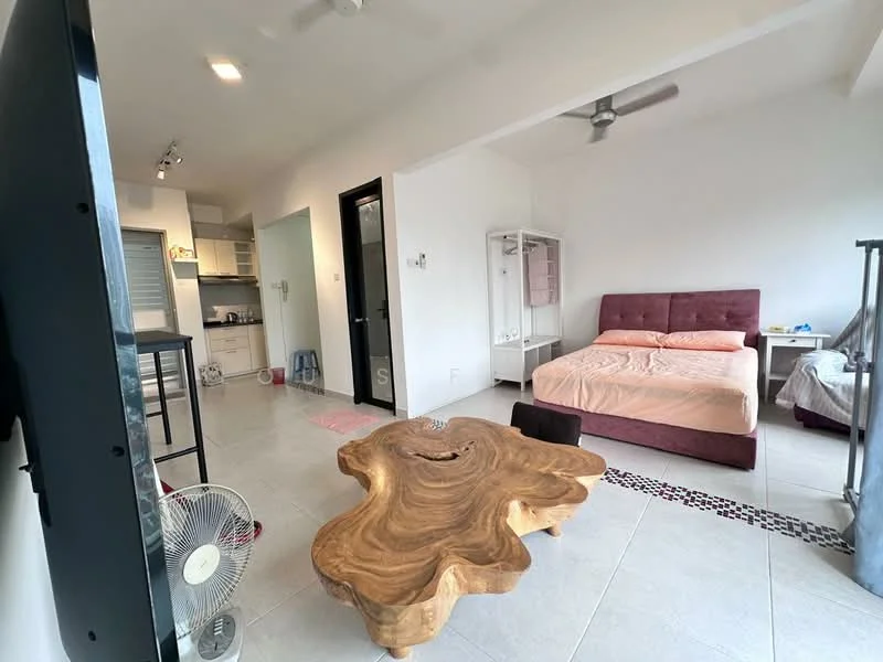 Living features: queen-size bed with pink bedding, wooden coffee table with organic shape, wall-mounted TV, ceiling fan, light-colored tiled flooring, open kitchen area, refrigerator, kitchen cabinets, sink, stool, decorative rug, white walls; style: modern.