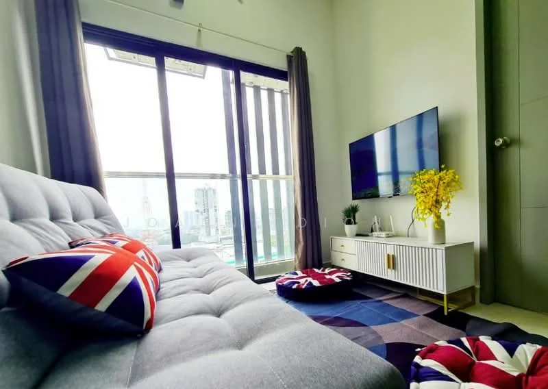 Living features: grey fabric sofa, decorative cushions with Union Jack pattern, wall-mounted TV, white TV console, large floor-to-ceiling windows, curtains in grey, area rug with geometric pattern, decorative yellow flowers in vase; style: modern; view: city.