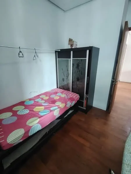 Bedroom features: single bed with polka dot bedding, built-in wardrobe with sliding doors, wooden flooring, white painted walls, hanging rod for clothes, door leading to hallway.