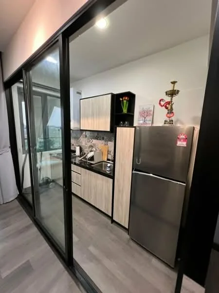 Kitchen features: stainless-steel fridge, built-in oven, freestanding range oven, microwave, white shaker cabinets, black countertop, tile backsplash with geometric pattern, kitchen utensils on display, wooden flooring, recessed downlights, glass sliding door leading to balcony; style: modern; view: city.