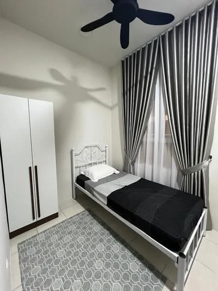 Bedroom features: single bed with white metal frame, black and white bedding, grey area rug with geometric pattern, white wardrobe with two doors, floor-to-ceiling window with sheer curtains, grey and white striped curtains, ceiling fan, white painted walls, tile flooring; style: modern.