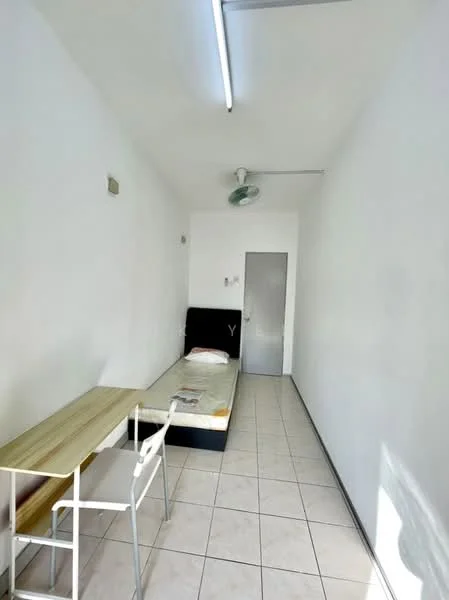 Room features: single bed, white painted walls, tile flooring, ceiling fan, window with no treatment, wooden table, white metal chair, door, light fixture on ceiling; style: minimalist.