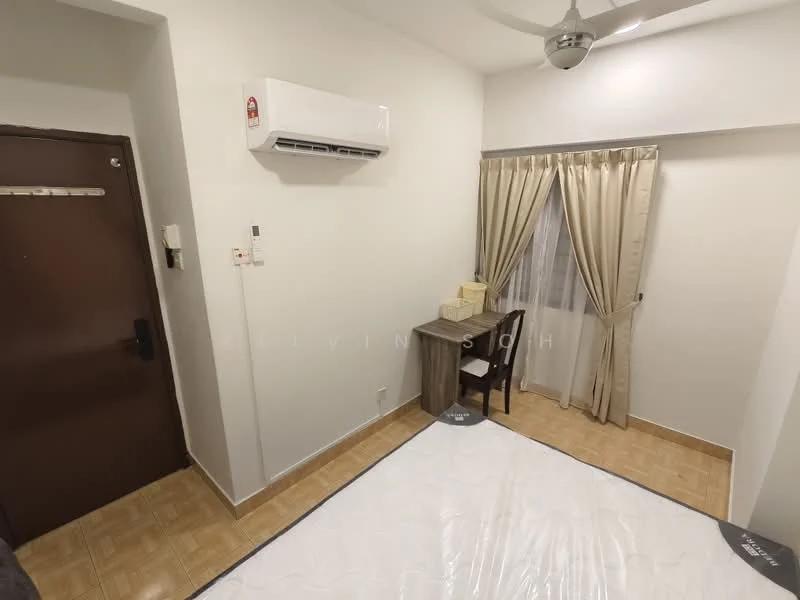 Bedroom features: white painted walls, vinyl plank flooring, 1 wall-mounted split AC, ceiling fan, window with sheer curtains, brown wooden desk, black chair, double bed frame, decorative boxes on desk.