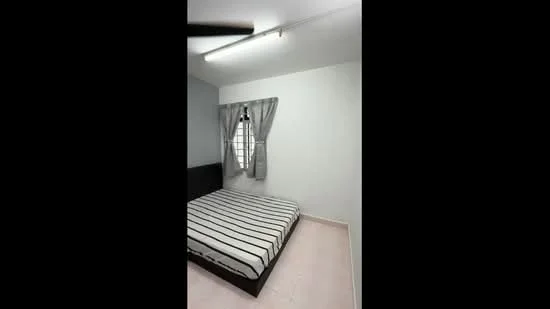 Bedroom features: striped bed linen, queen-size bed, white painted walls, light grey accent wall, curtains with tiebacks, single window with grille, ceiling light fixture, tile flooring.