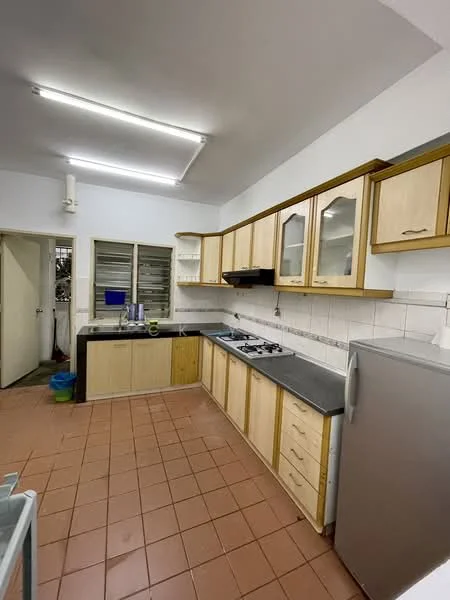 Kitchen features: wood cabinetry with glass-front upper cabinets, grey countertop, stainless-steel sink, 4-burner gas hob, built-in range hood, stainless-steel fridge, white tiled backsplash, brown tiled flooring, window with metal grilles, wall-mounted shelves, overhead fluorescent lighting.