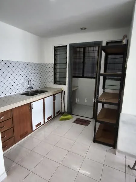 Kitchen features: single-bowl stainless-steel sink, chrome pull-down faucet, laminate countertop, white tiled backsplash, wood cabinetry with brown finish, built-in shelving unit, ceramic tile flooring, window with metal grille, cleaning broom, door leading to balcony.