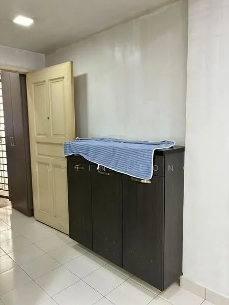 Room features: white painted walls, glossy white tile flooring, dark wood cabinetry, closed cabinet doors, countertop with blue striped cloth, light fixture on ceiling, door with panel design, visible entrance to another room; style: modern.