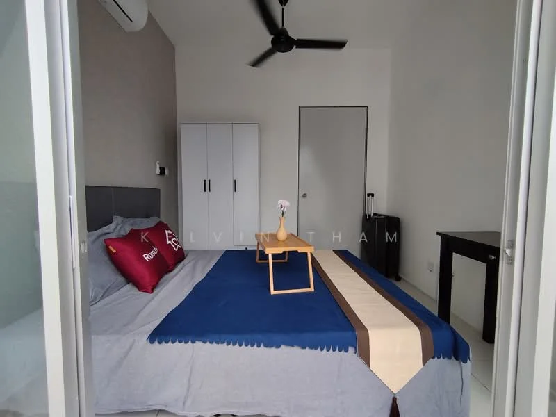 Bedroom features: queen-size bed with grey bedding, two red decorative pillows, blue throw blanket, white wardrobe, black bedside table, ceiling fan, white walls, grey accent wall, floor tiles, window with no visible treatment, door leading to hallway; style: modern.